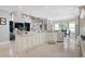 Open kitchen design with granite countertops, large island, and adjacent dining area at 948 Saint Lyonn Cts, Marietta, GA 30068