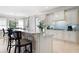 Bright kitchen features an island with bar seating, granite counters, and modern appliances at 948 Saint Lyonn Cts, Marietta, GA 30068