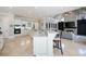 Spacious open-concept kitchen with a large granite island and views to the adjacent living room at 948 Saint Lyonn Cts, Marietta, GA 30068