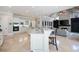 Large open kitchen with stone countertops, white cabinetry, stainless steel appliances, and seating at island at 948 Saint Lyonn Cts, Marietta, GA 30068