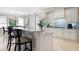 Open kitchen with a large island, white cabinetry, pendant lighting, and stainless steel appliances and breakfast area at 948 Saint Lyonn Cts, Marietta, GA 30068