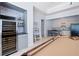 Convenient kitchenette featuring modern appliances and bar seating integrated into the game room for easy entertaining at 948 Saint Lyonn Cts, Marietta, GA 30068