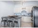 Stylish kitchenette featuring white cabinetry, modern appliances and tiled backsplash in a comfortable living space at 948 Saint Lyonn Cts, Marietta, GA 30068