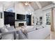 Vaulted ceiling living room with stone fireplace, custom cabinets, and natural light at 948 Saint Lyonn Cts, Marietta, GA 30068