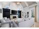 Cozy living room with stone fireplace, built-in shelving, and vaulted ceiling at 948 Saint Lyonn Cts, Marietta, GA 30068