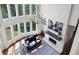 Sunlit living room featuring a fireplace, large windows, and a comfortable seating area at 948 Saint Lyonn Cts, Marietta, GA 30068