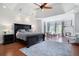 Elegant main bedroom with tray ceiling, fireplace and sitting area with large windows allowing for lots of light at 948 Saint Lyonn Cts, Marietta, GA 30068
