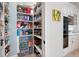 Walk-in pantry with custom shelving and cabinetry to maximize storage space and organization at 948 Saint Lyonn Cts, Marietta, GA 30068