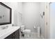 Clean powder room with modern fixtures and tiled flooring at 948 Saint Lyonn Cts, Marietta, GA 30068