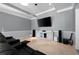Media room with comfortable seating, large screen TV, and entertainment center at 948 Saint Lyonn Cts, Marietta, GA 30068