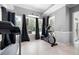Bright workout room featuring gym equipment, natural light, and a view of the outdoors at 948 Saint Lyonn Cts, Marietta, GA 30068