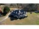 Aerial view of a stately home with expansive grounds and manicured landscaping at 2002 Orchard Terrace, Loganville, GA 30052