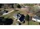 Sprawling property features a large house with a deck, garage, and outbuilding with mature trees at 2002 Orchard Terrace, Loganville, GA 30052