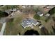 Aerial view showcases the property's layout, complete with extensive decks, lawns, and outbuildings at 2002 Orchard Terrace, Loganville, GA 30052