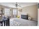 Bright Bedroom featuring a ceiling fan, two windows, and whimsical wall decor at 2002 Orchard Terrace, Loganville, GA 30052