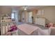 This bedroom features an open floor plan with pink accents and large flower decorations at 2002 Orchard Terrace, Loganville, GA 30052