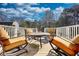 Outdoor deck with four chairs and a table under a sunny sky at 2002 Orchard Terrace, Loganville, GA 30052