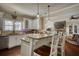 Modern kitchen with stainless steel appliances, a breakfast bar, and granite countertops at 2002 Orchard Terrace, Loganville, GA 30052