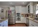 Well-equipped kitchen featuring stainless steel appliances and ample cabinet space at 2002 Orchard Terrace, Loganville, GA 30052