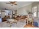 Spacious living room with hardwood floors, neutral tones, and an open layout to the kitchen at 2002 Orchard Terrace, Loganville, GA 30052