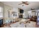 Comfortable living room featuring a stone fireplace, neutral decor, and hardwood floors at 2002 Orchard Terrace, Loganville, GA 30052