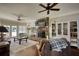 Cozy living room with stone fireplace, ceiling fans, and ample natural light at 2002 Orchard Terrace, Loganville, GA 30052