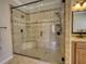 This shower features decorative tile and dual shower heads with a bench seat at 2002 Orchard Terrace, Loganville, GA 30052