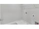 Compact laundry room with hookups and shelving at 3925 Cordano Ln, Lawrenceville, GA 30044