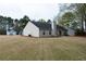 Large backyard with ample lawn space and mature trees at 4580 Darrowby Dr, Powder Springs, GA 30127