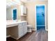 Bathroom has vanity, toilet and doorway to walk-in closet at 4580 Darrowby Dr, Powder Springs, GA 30127