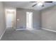 Bedroom features plush carpeting, a ceiling fan, neutral paint and en suite bath at 4580 Darrowby Dr, Powder Springs, GA 30127