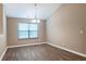View of dining room featuring a chandelier, window, and neutral paint at 4580 Darrowby Dr, Powder Springs, GA 30127