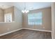 Dining room with lots of light, neutral paint, and wood-look flooring throughout at 4580 Darrowby Dr, Powder Springs, GA 30127