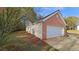 Exterior view of house and garage at 4580 Darrowby Dr, Powder Springs, GA 30127