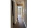 Hallway with wood floors, connecting other rooms in home at 4580 Darrowby Dr, Powder Springs, GA 30127