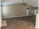 Spacious living room with vaulted ceilings and wood-look flooring throughout the home at 4580 Darrowby Dr, Powder Springs, GA 30127