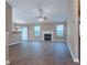 Spacious living area featuring wood floors, fireplace, and natural light at 4580 Darrowby Dr, Powder Springs, GA 30127