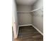 A spacious walk-in closet with wood floor and metal shelving at 4580 Darrowby Dr, Powder Springs, GA 30127