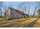 A spacious brick home with a sprawling yard and mature trees, perfect for outdoor enjoyment at 1237 Samuel St, Marietta, GA 30008