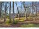Brick home nestled among mature trees, offering a sense of privacy and tranquility at 1237 Samuel St, Marietta, GA 30008