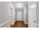 Hallway featuring hardwood floors, neutral paint, and traditional trim, providing a timeless appeal at 1237 Samuel St, Marietta, GA 30008