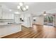 Open kitchen with granite countertops, white cabinets, and stainless steel appliances at 1237 Samuel St, Marietta, GA 30008