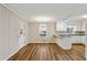Eat-in kitchen featuring white cabinets, granite countertops, and modern lighting at 1237 Samuel St, Marietta, GA 30008