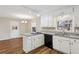 Cozy kitchen nook featuring granite countertops, white cabinets, and an eat-in bar at 1237 Samuel St, Marietta, GA 30008