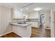 Efficient kitchen layout with granite countertops, white cabinets, and modern appliances at 1237 Samuel St, Marietta, GA 30008