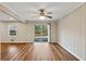 Living room with wood floors, a ceiling fan and sliding glass doors to the outdoors at 1237 Samuel St, Marietta, GA 30008