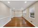 Spacious living area with hardwood floors, large windows, and neutral paint, perfect for relaxation at 1237 Samuel St, Marietta, GA 30008