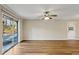 Bright living room featuring wood floors, a ceiling fan, and sliding glass doors to the outside at 1237 Samuel St, Marietta, GA 30008