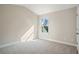 Cozy carpeted bedroom with a window view of trees and a sunny exposure at 3935 Cordano Ln, Lawrenceville, GA 30044
