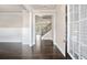 Inviting foyer with dark hardwood floors, white trim, and paneled wainscoting at 3935 Cordano Ln, Lawrenceville, GA 30044